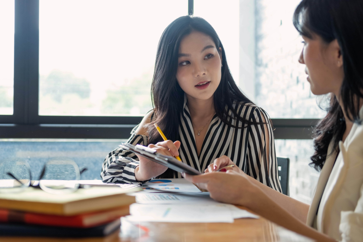 asian businesswoman in a meeting with another lady